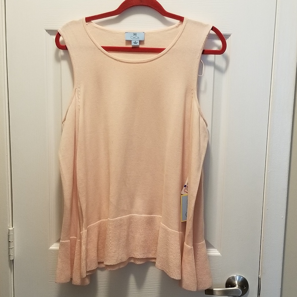 Pink sweater with ruffled hem